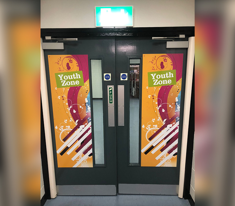 Cost-effective wall vinyls installed on an internal door of Bolton Council’s Young People’s Centres