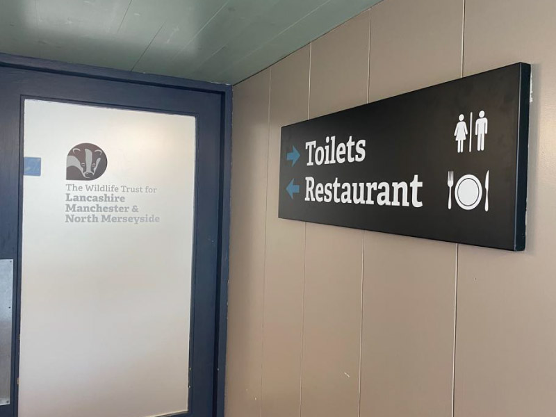 Impression printed and installed branded wayfinding and directional signage around internal areas at Brockholes in Preston, Lancashire to help visitors find their way around this important visitor attraction for Lancashire