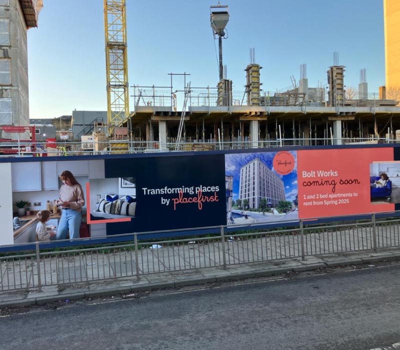 Bespoke construction hoardings printed & installed for Placefirst property developers by Impression, featuring large format graphics & images printed onto robust hoarding material designed to withstand all Manchester weathers.