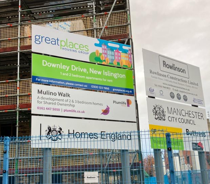 Impression installed 2-post, ground-mounted external signage for Greatplaces Housing Group, incorporating their brand colours & information of the new development in Manchester.