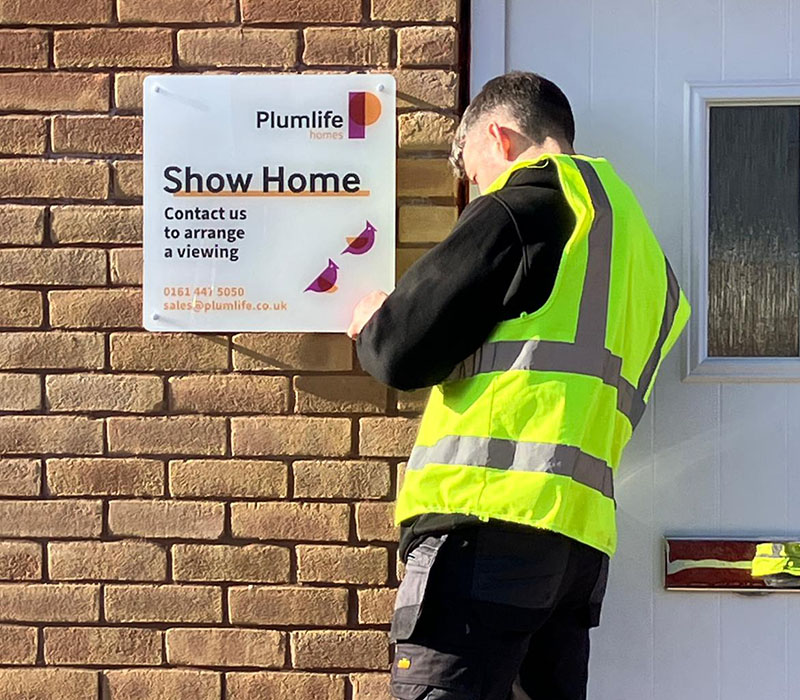 Hardwearing acrylic wall sign at the entrance of a show home