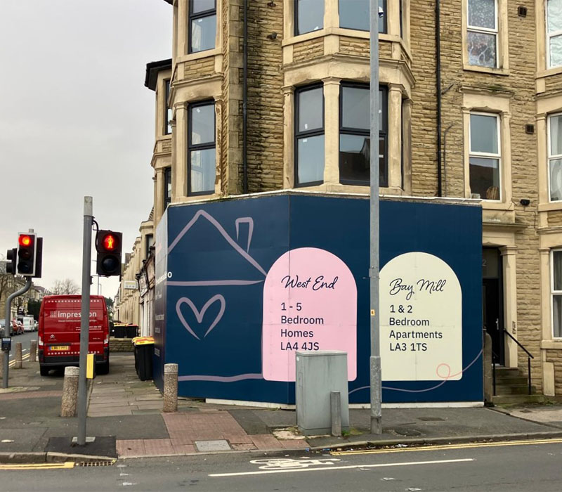 Large site hoarding at one of PlaceFirst’s property remodelling projects in the West End of Morecambe.