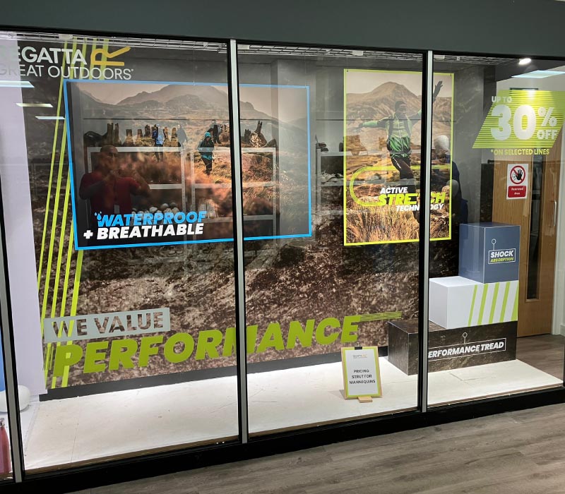 Photo of Regatta shopfront with retail campaign vinyls ordered via ImPrint on demand print service