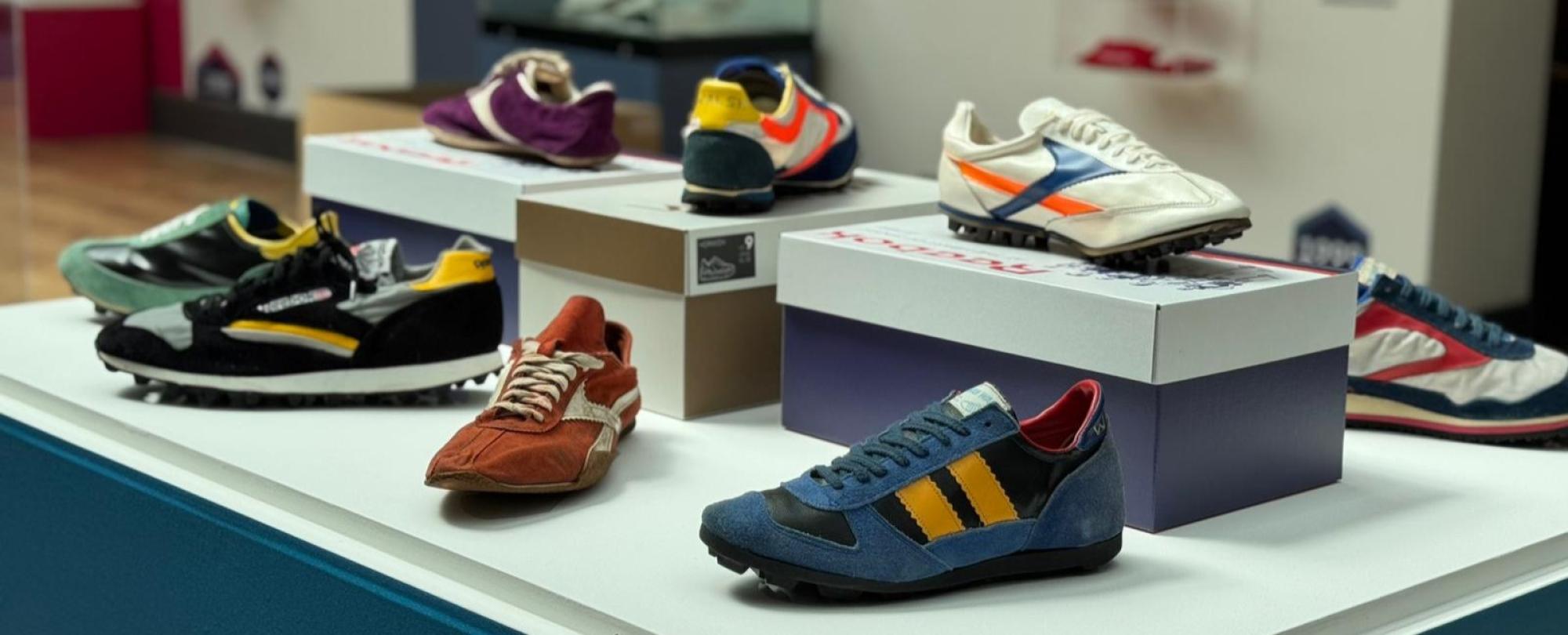 Image of vintage shoes on a bespoke display stand created by Impression