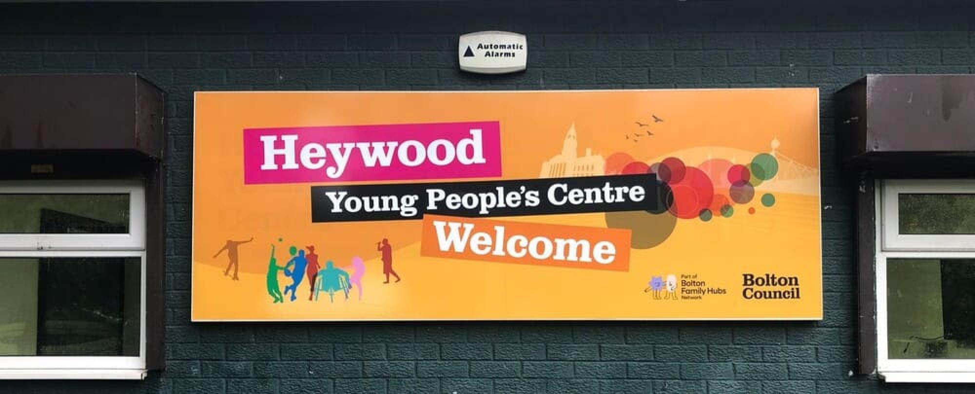 Heywood Young People's Centre welcome signage on the outside of their building in Bolton, installed by Impression