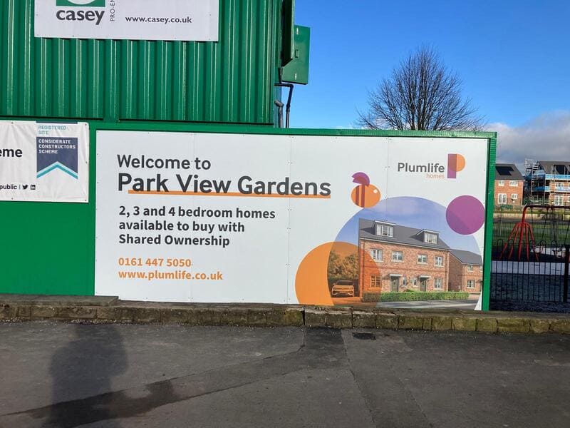 Plumlife branded construction and site hoardings printed in-house by Impression using robust materials, and installed by Impressionâs CSCS-certified Deliver team at a new Plumlife construction site in Oldham, Greater Manchester