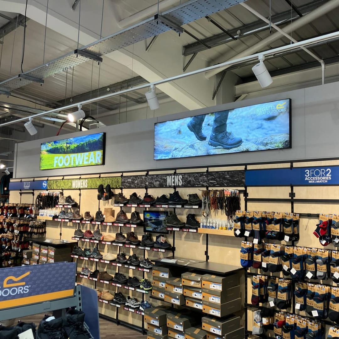 Regatta footwear department at its store in Castleford, including illuminated signage above the shoes 